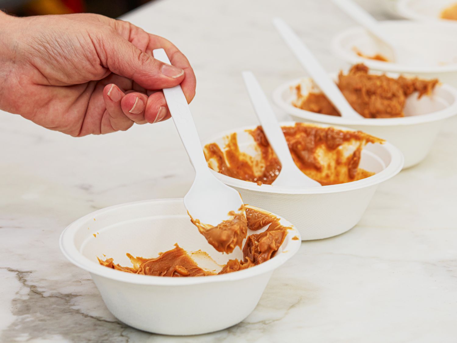Bowls of crunchy peanut butter.