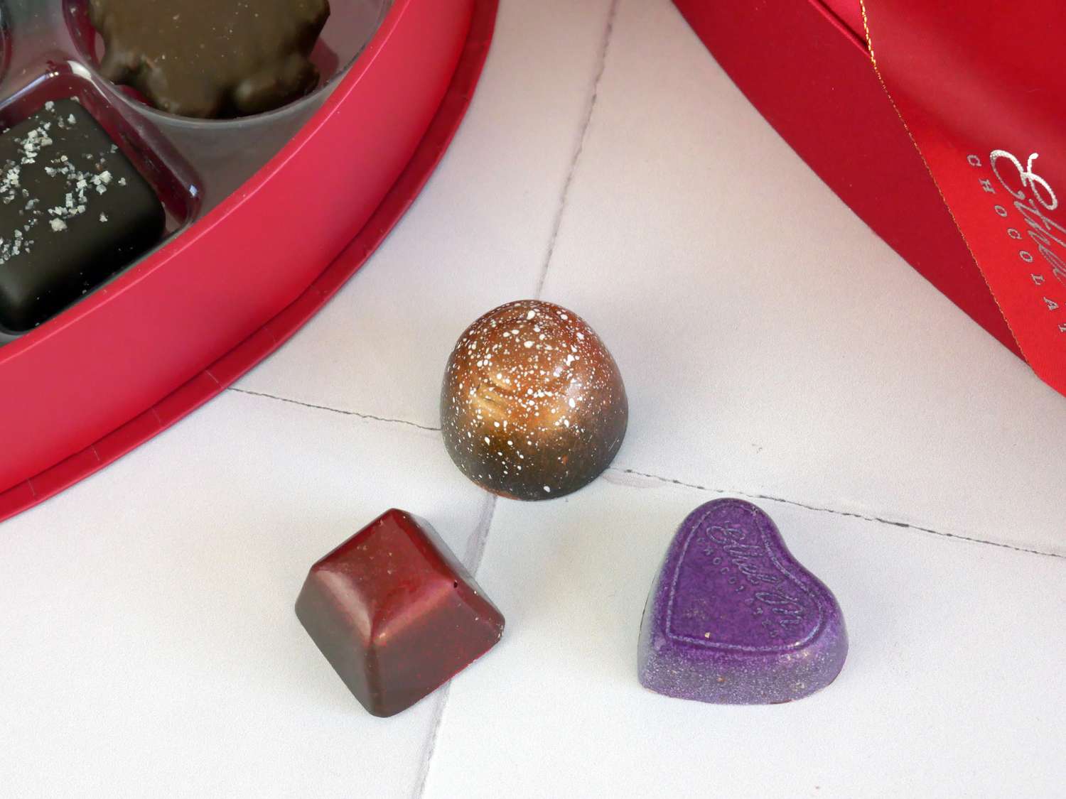 closeup of three chocolates from ethel m box