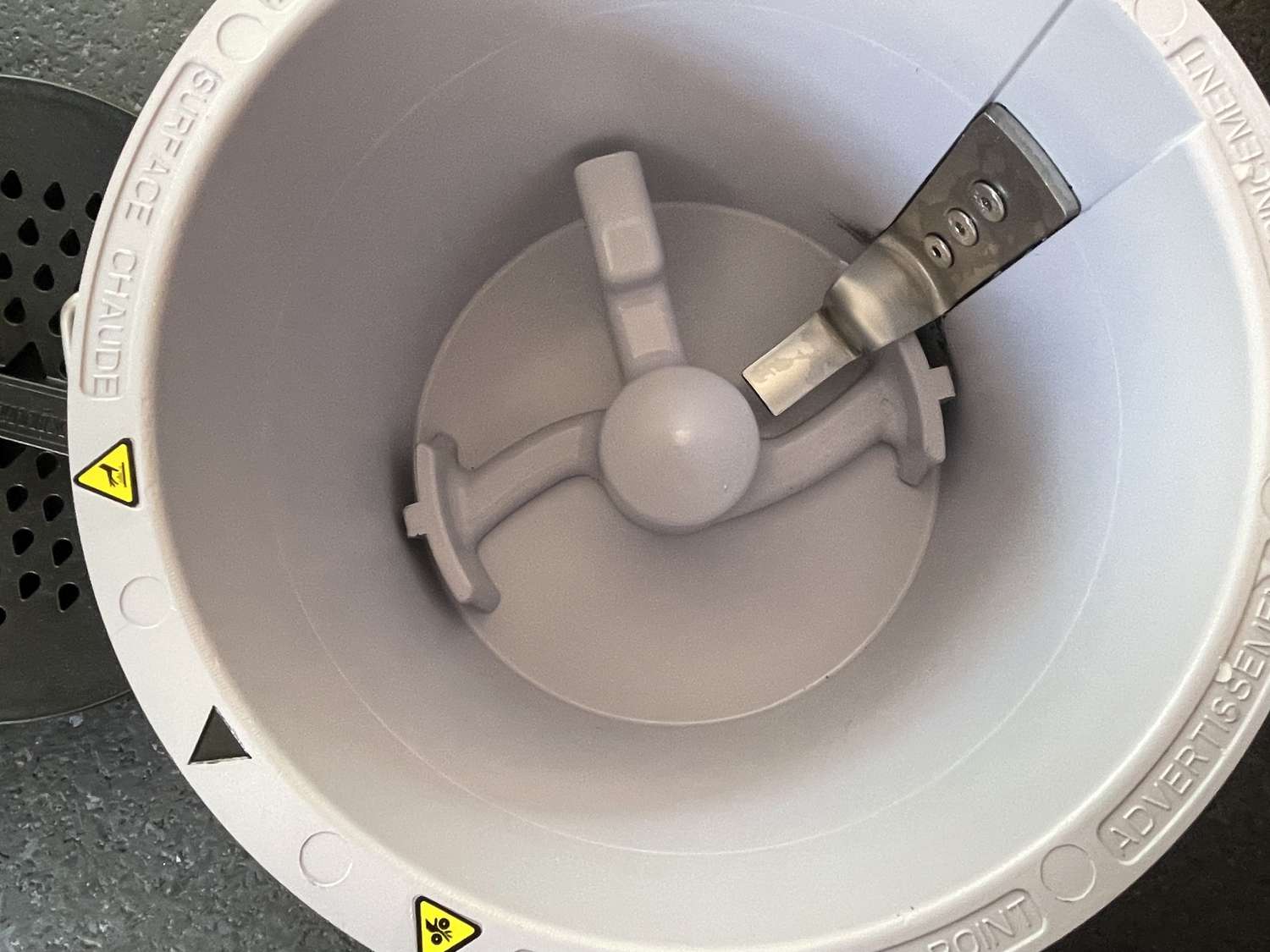 An overhead shot of the Vitamix's bucket and its blade