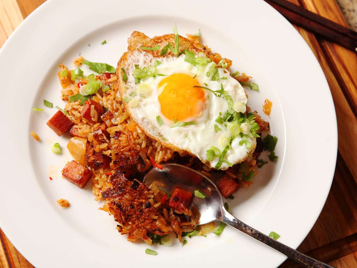 Overhead photo of kimchi fried rice topped with fried egg.