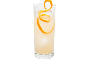 The Number 8, a ginger liqueur-based cocktail in a Collins glass with a long twist of grapefruit peel.