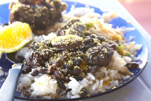Closeup of feijoada served over rice.