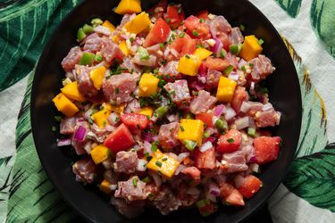 kinilaw (Filipino tuna ceviche) on a plate with a tropical print 