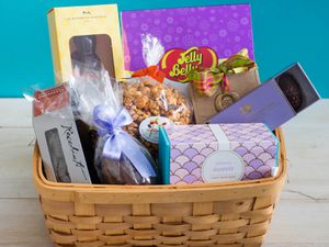 A basket of different candies and treats for Easter. 