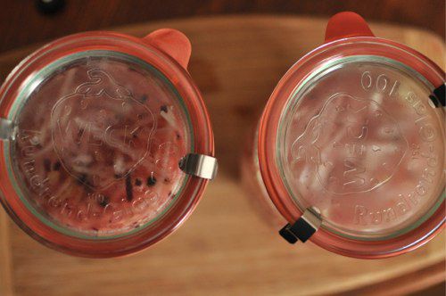 Overhead view of the jars of pickled kohlrabi after the lids are affixed.