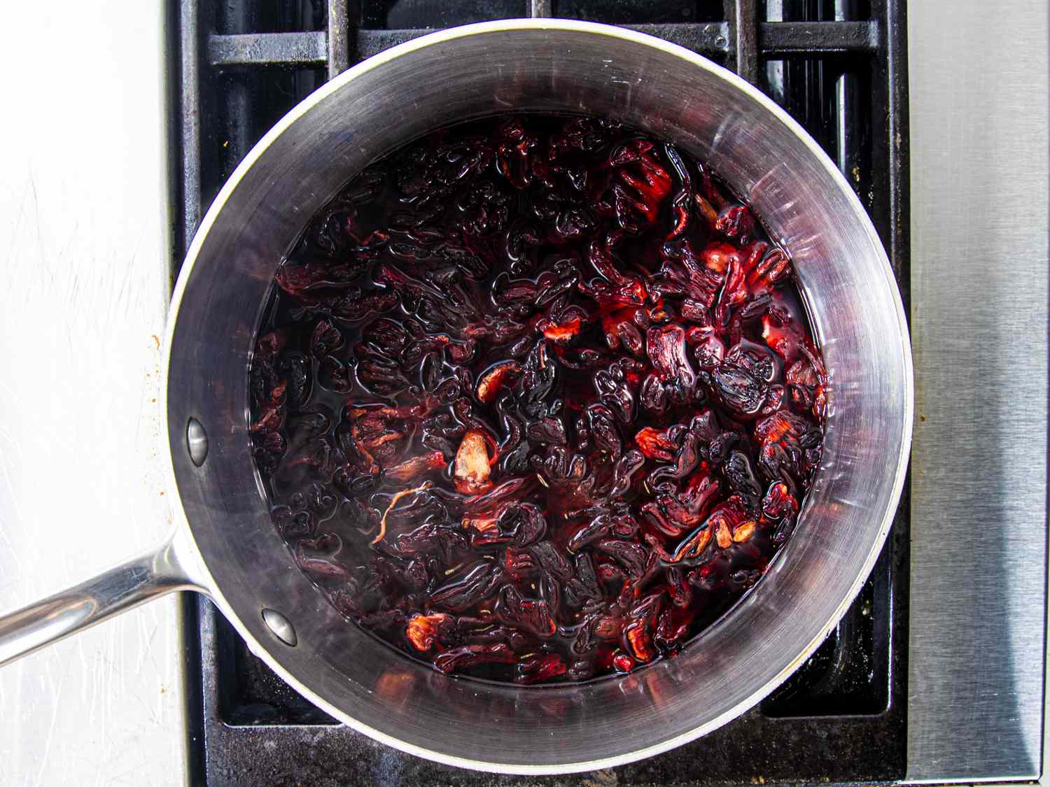 Hibiscus boiling in pot on stove