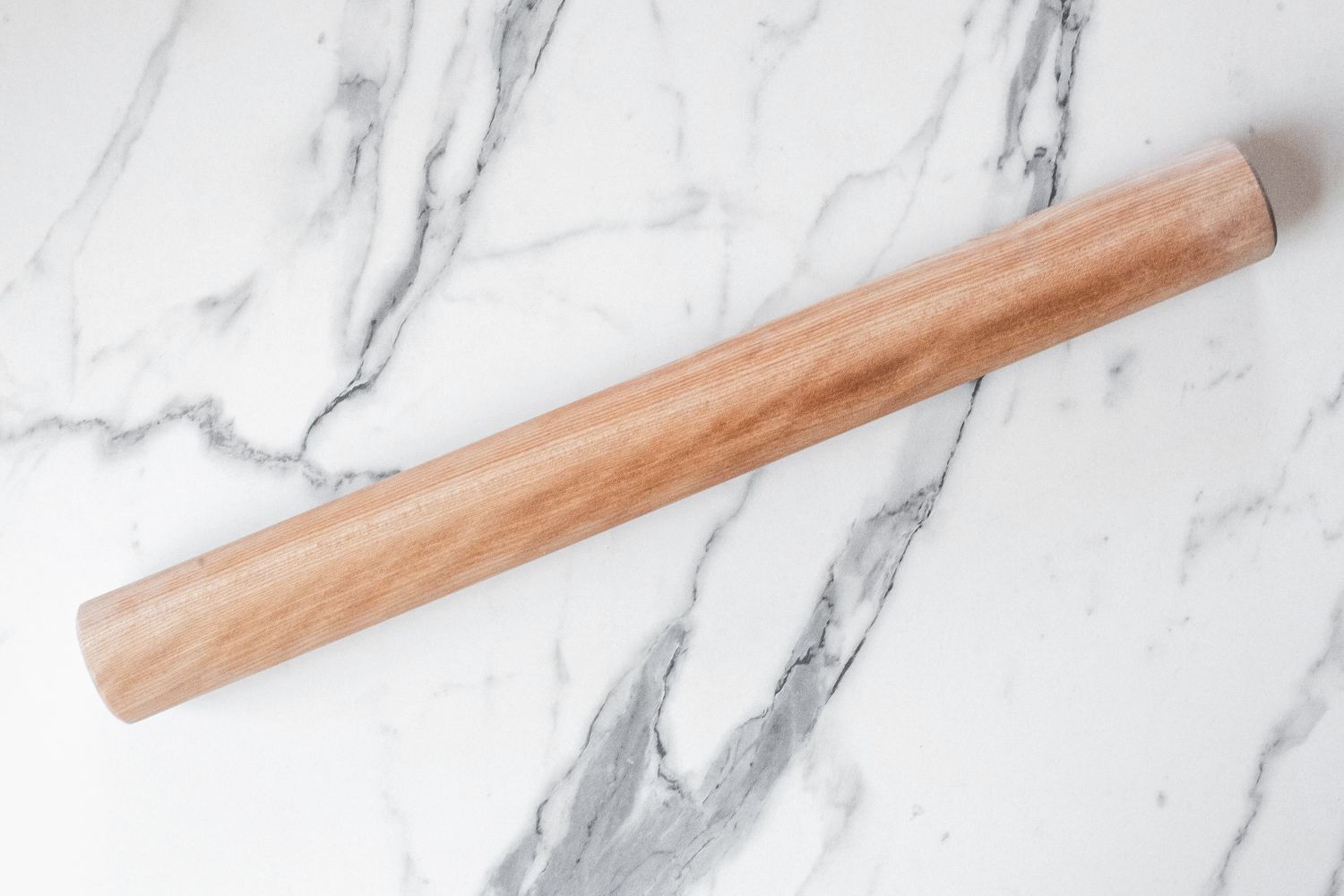 A J.K. Adams Dowel Rolling Pin on a marble surface