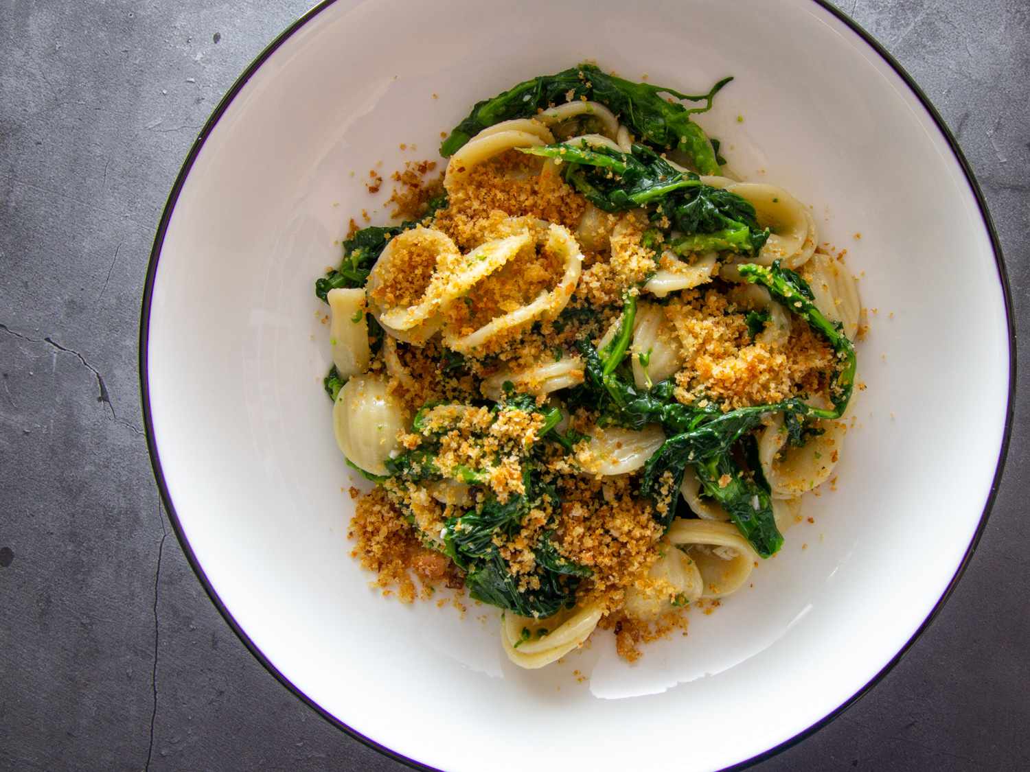 Orecchiette con le Cime di Rapa in a white pasta bowl.