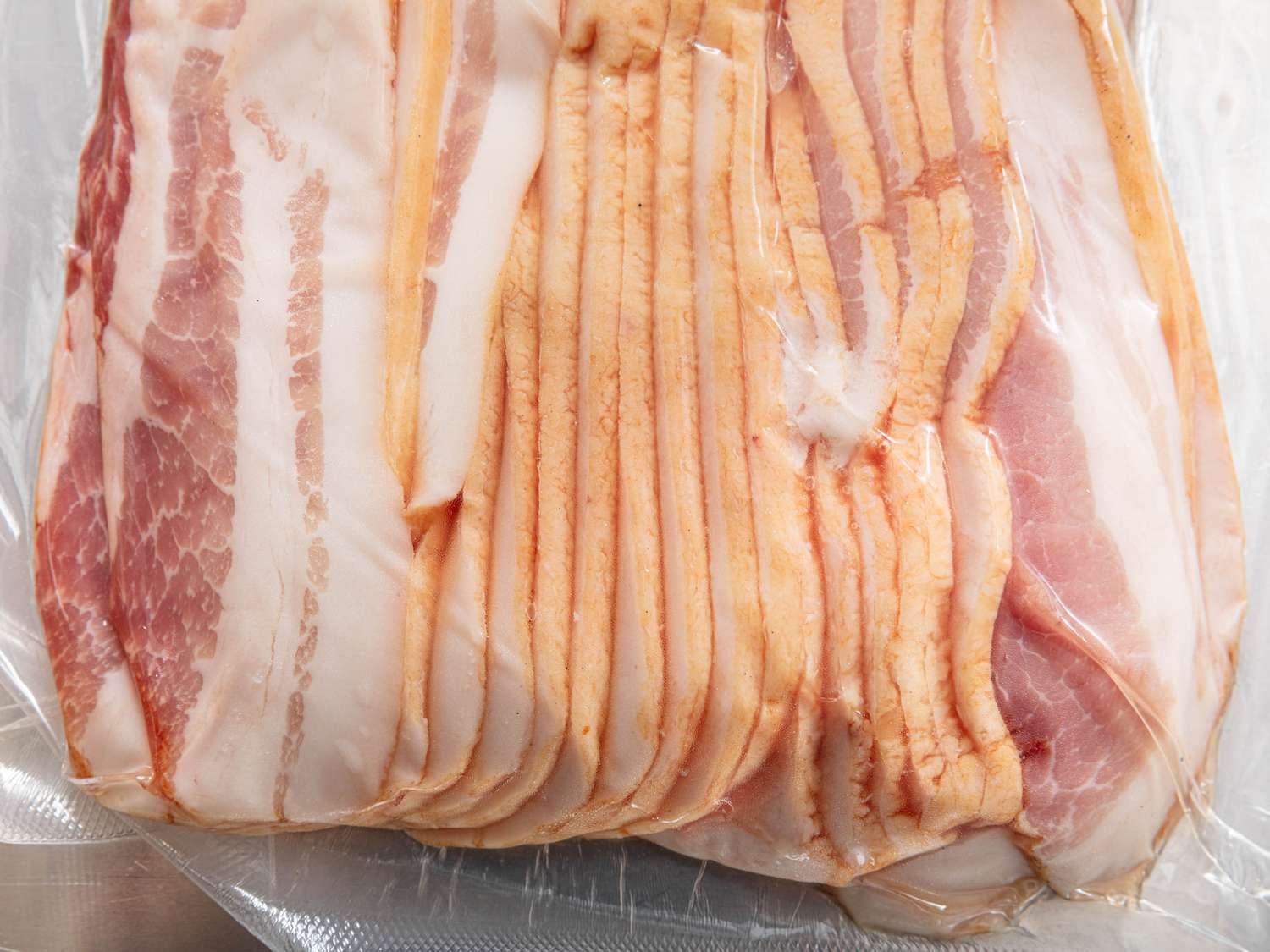 Partially frozen pre-sliced bacon 
