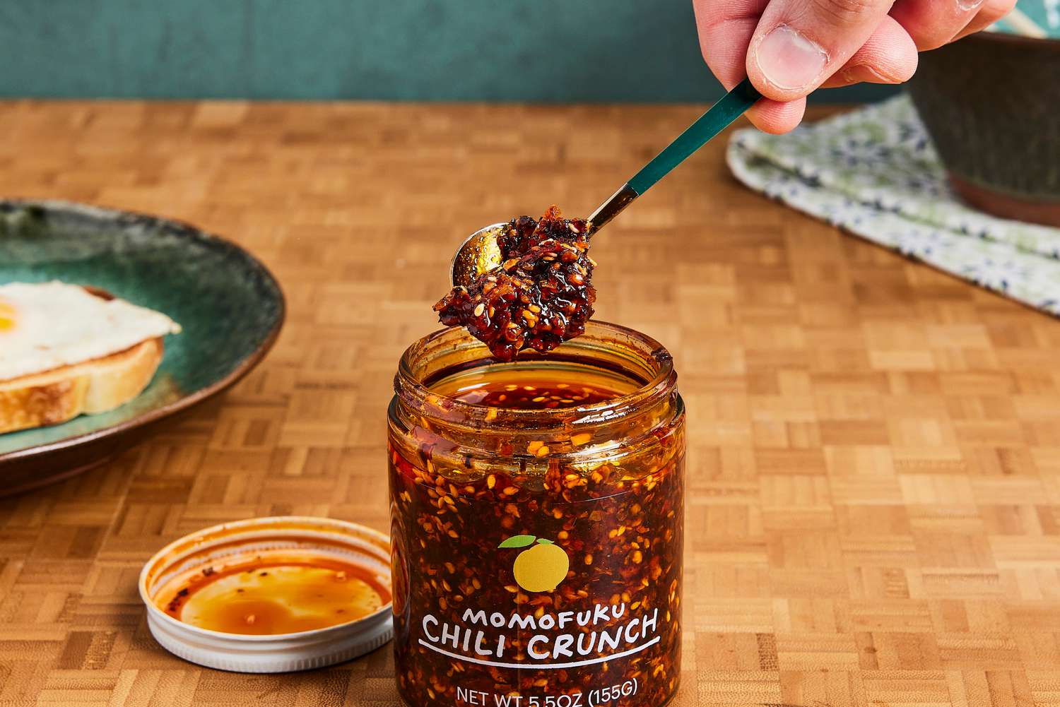 Momofuku Chili Crunch being scooped