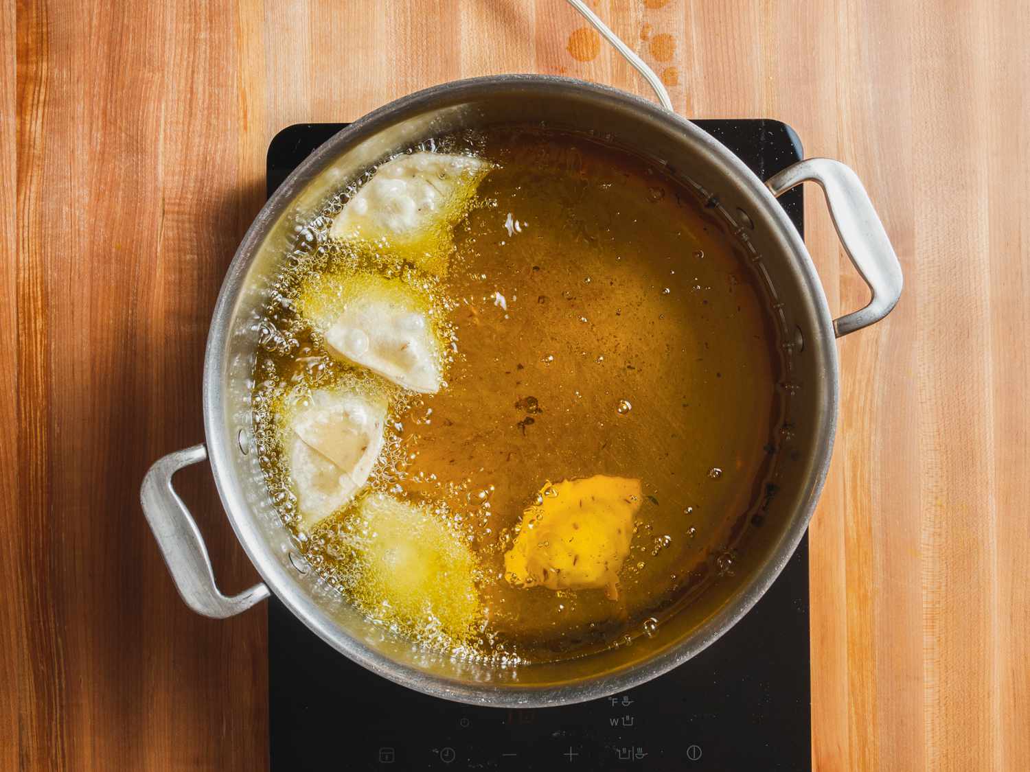 Samosa frying in oil