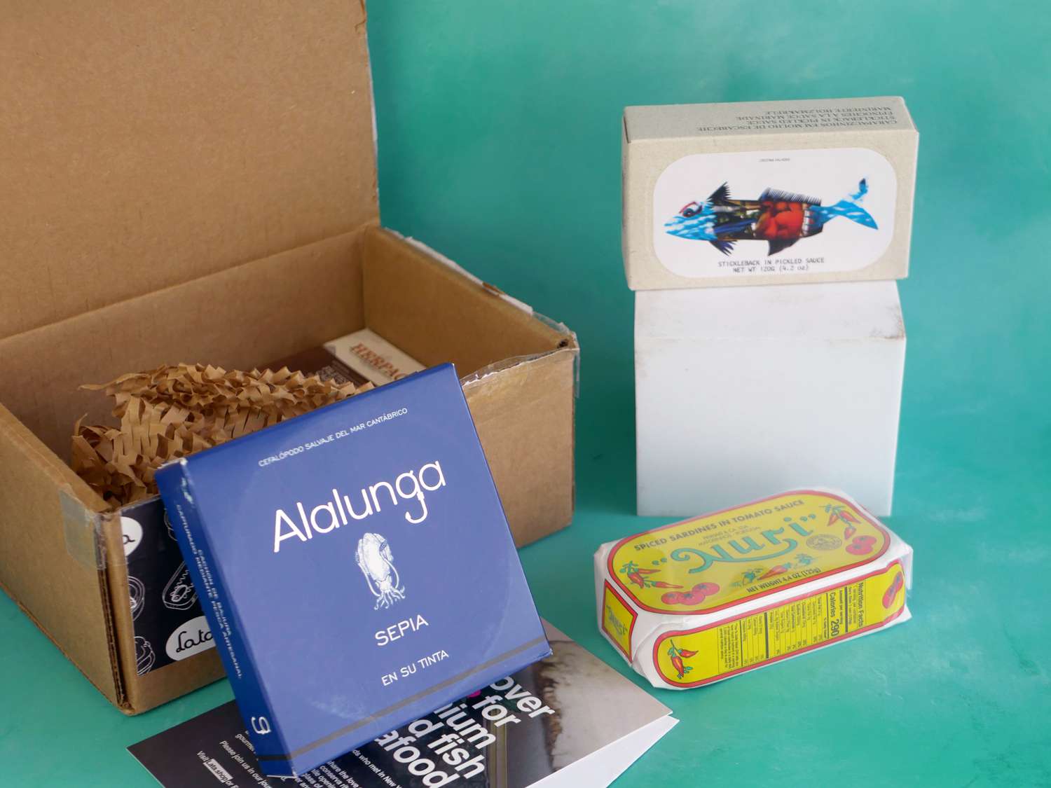 a box with three of the tinned fish on display outside it