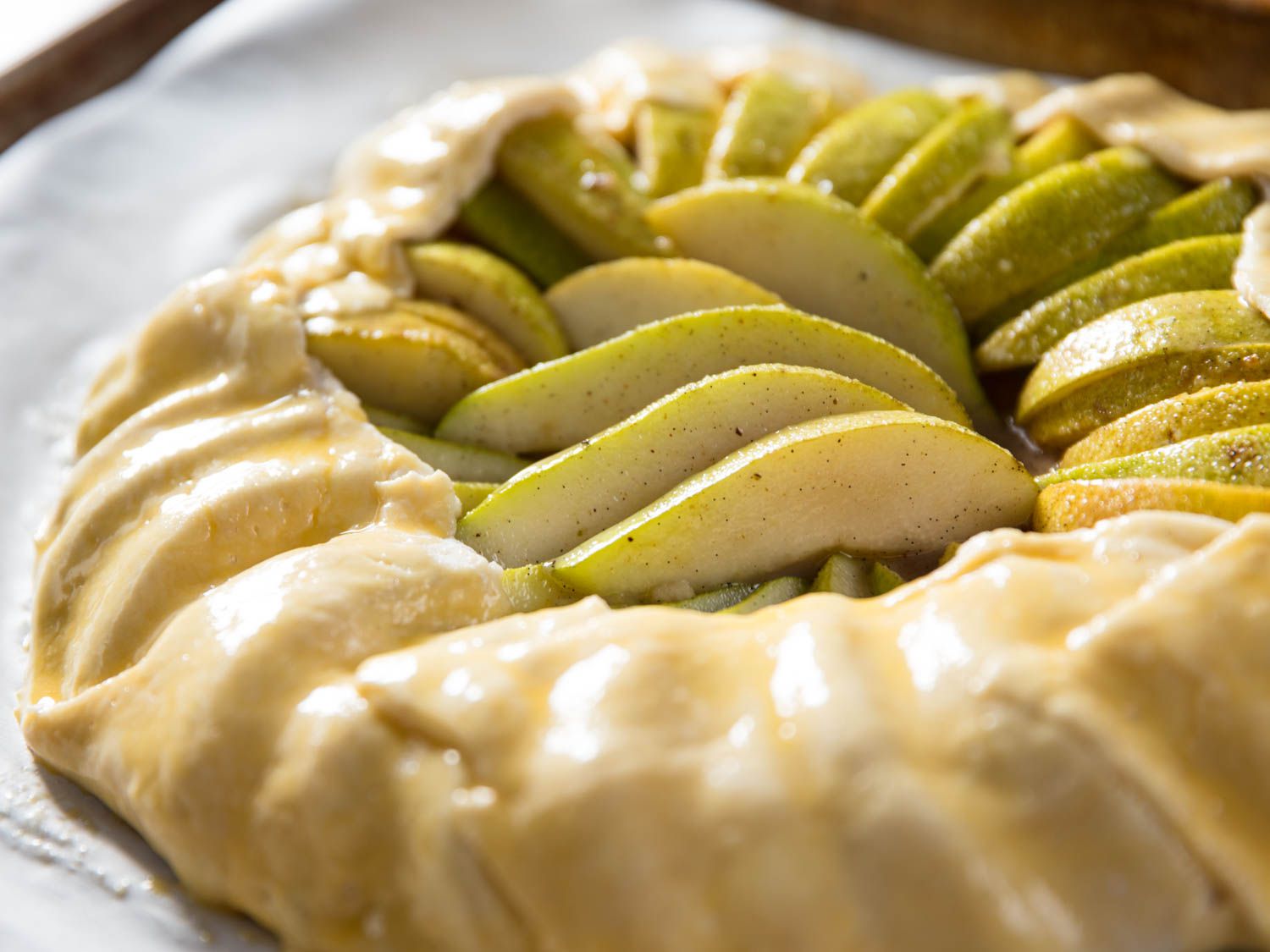 The galette dough brushed with egg wash