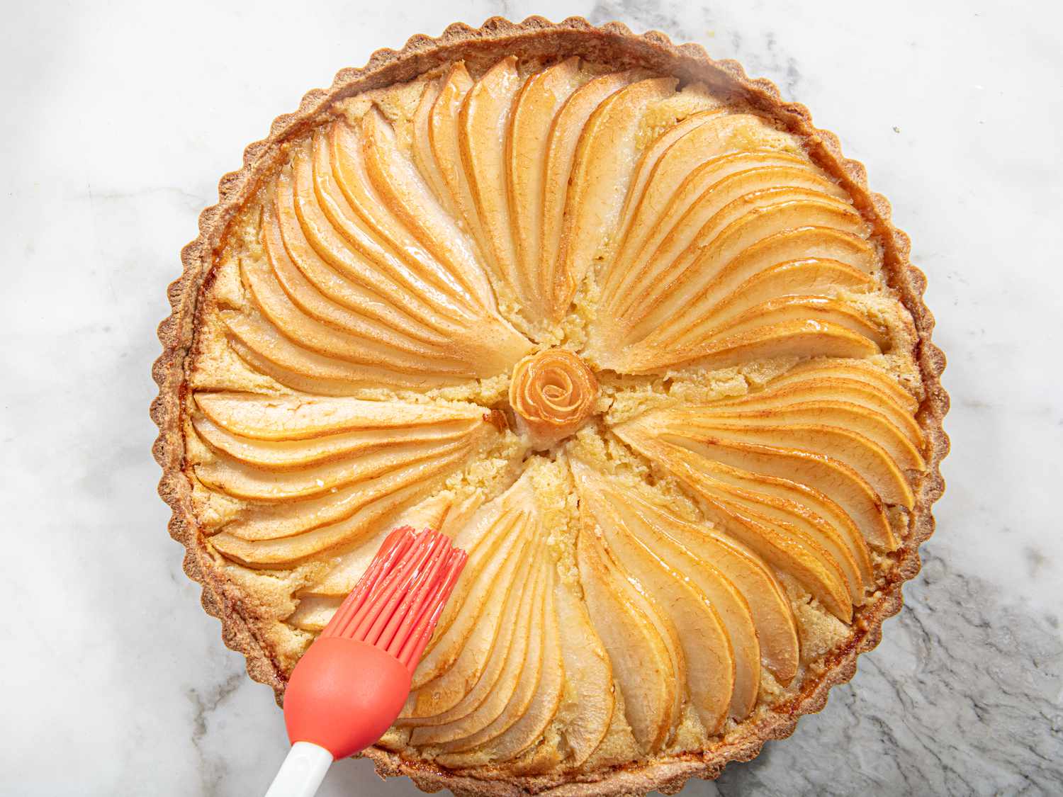 Brushing pear tart