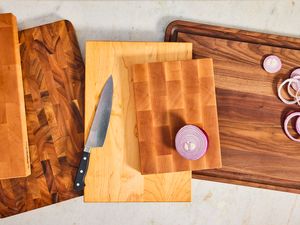 A collection of wooden cutting boards on a white background