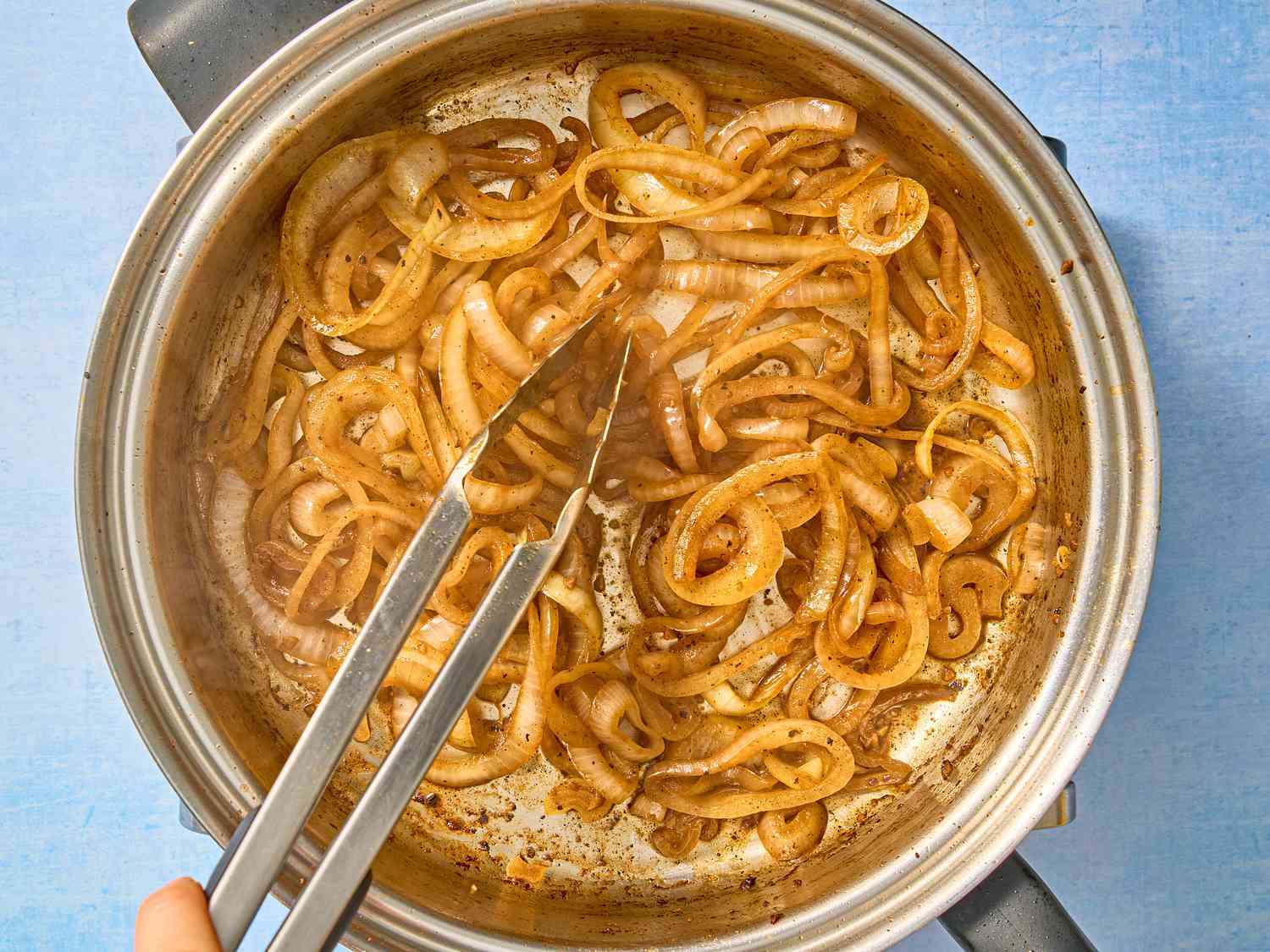 Browned sauteed onions in the tall skillet