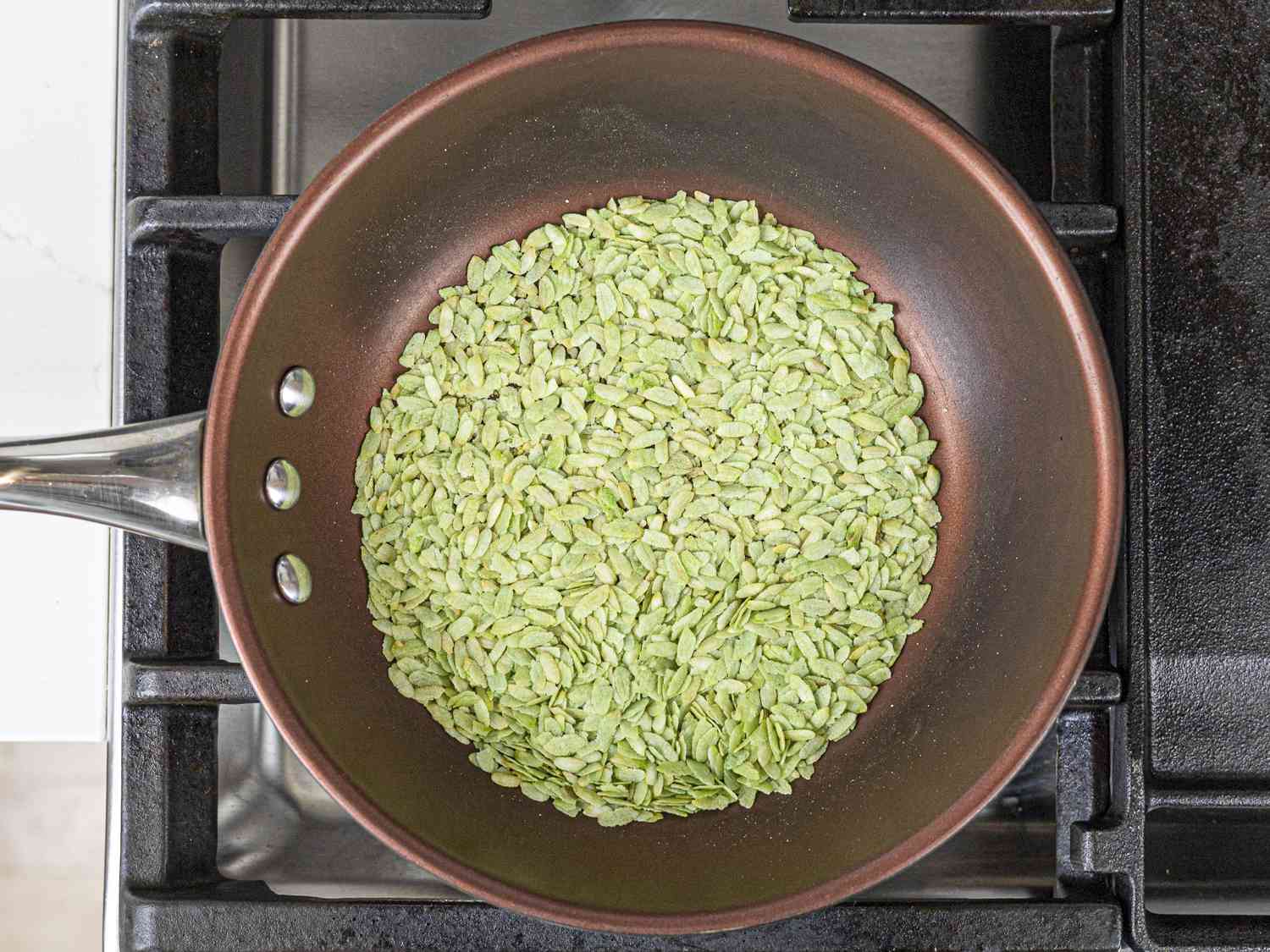 Pinipig being tossed in a pan