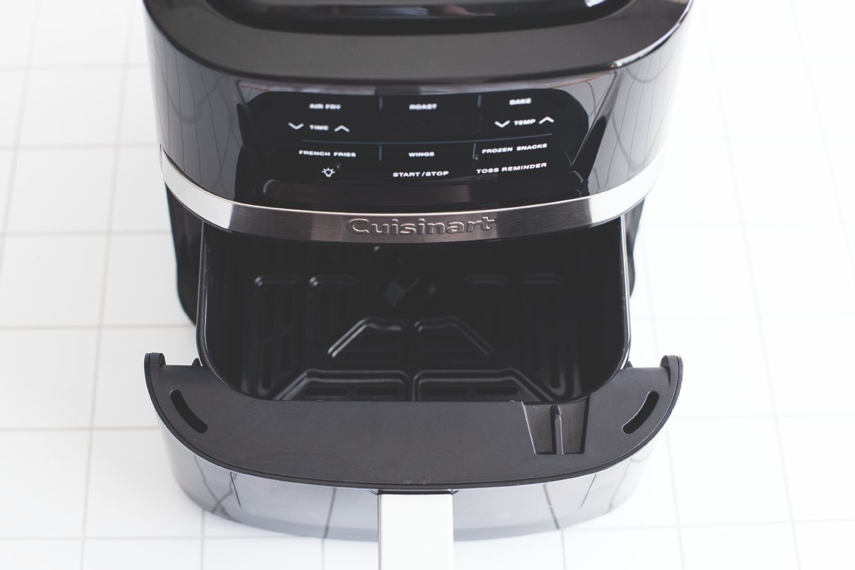 Cuisinart air fryer with an open basket showing control panel and brand name