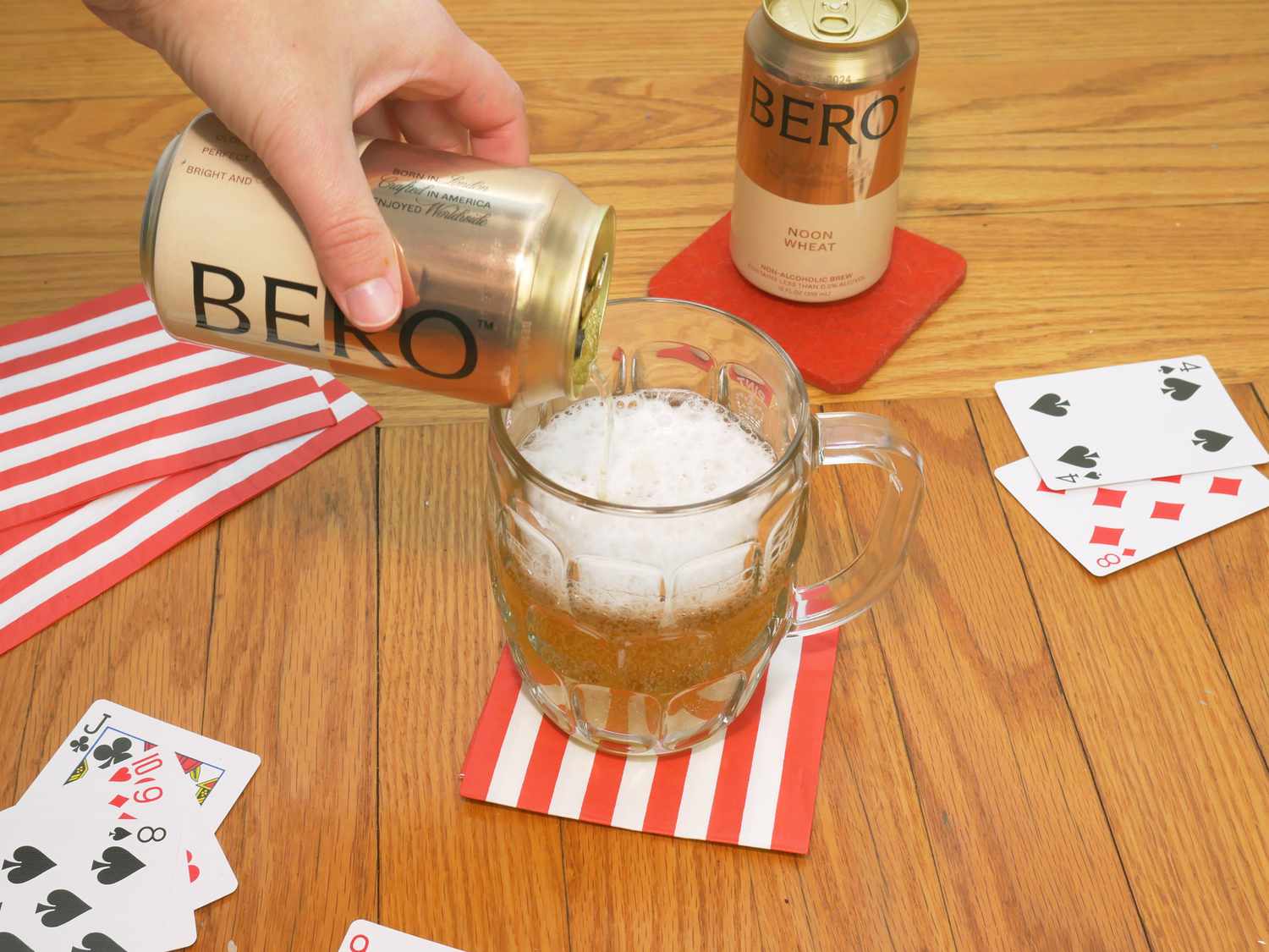 a person pouring bero noon wheat into a glass
