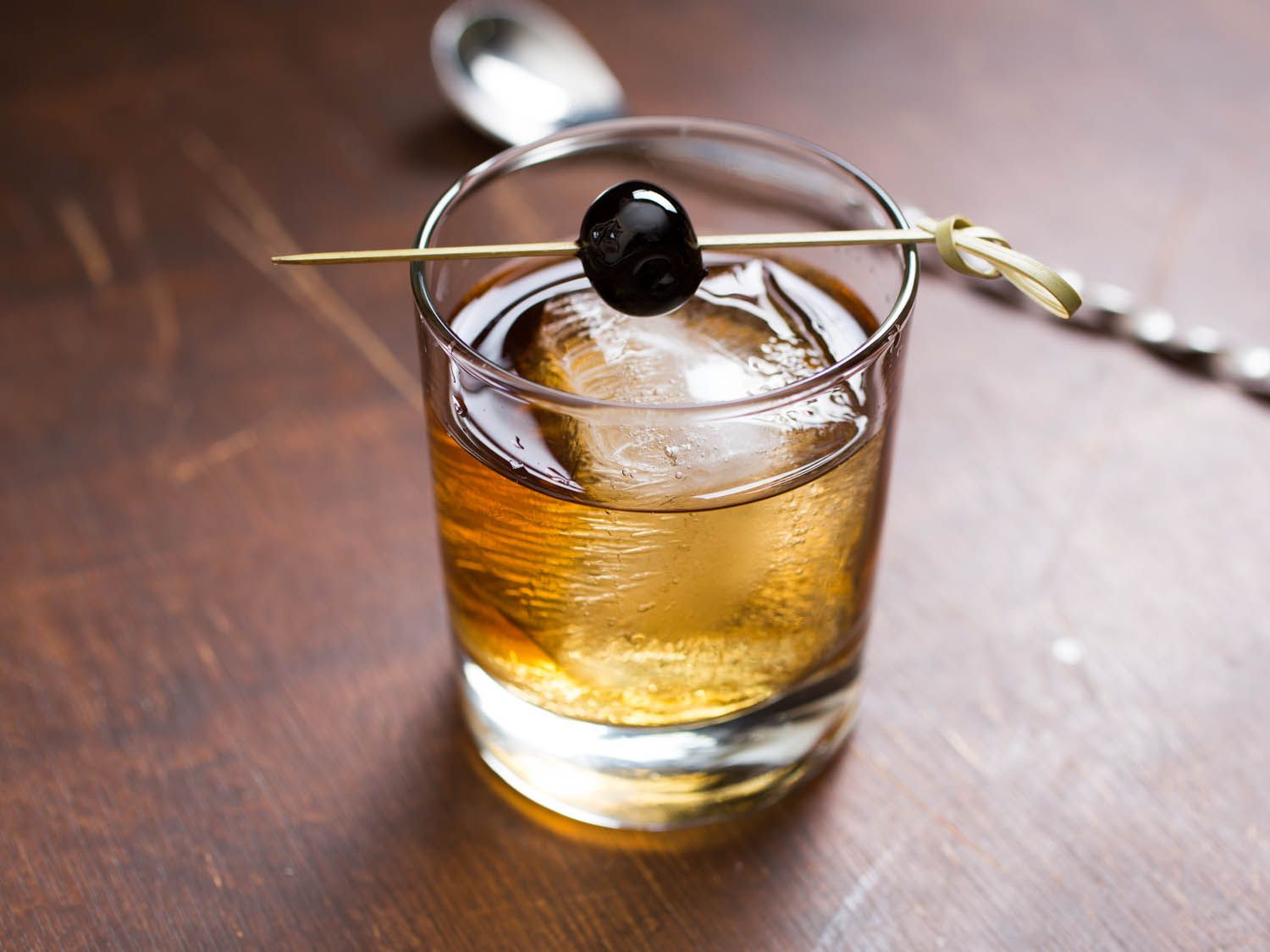 A Vieux Carre cocktail with a cherry garnish.