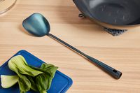 a wok chuan on a wooden countertop