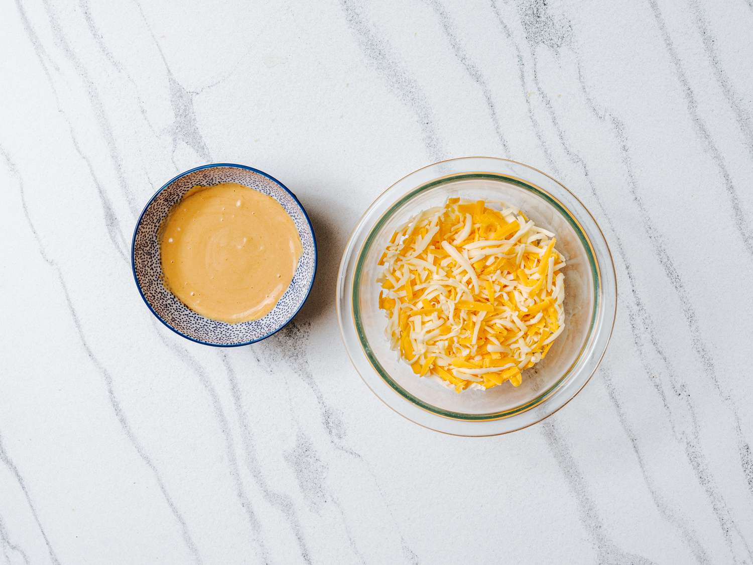 mixed condiments, and blended cheeses in bowls side by side. 