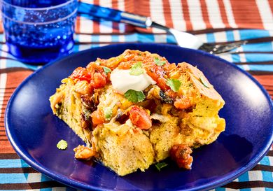 A serving of Southwest breakfast strata on a blue plate