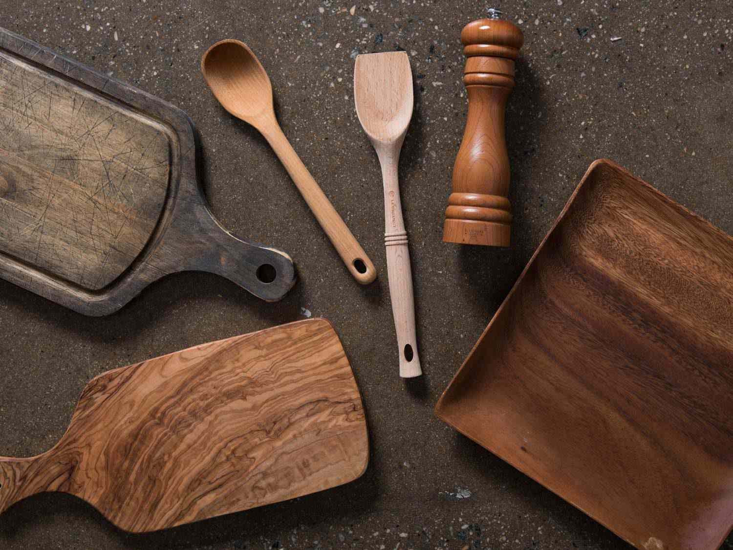 Wooden spoons, pepper mill, and cutting boards.
