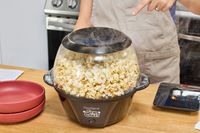 Steam is emitted from the West Bend Stir Crazy Electric Hot Oil Popcorn Popper during popping