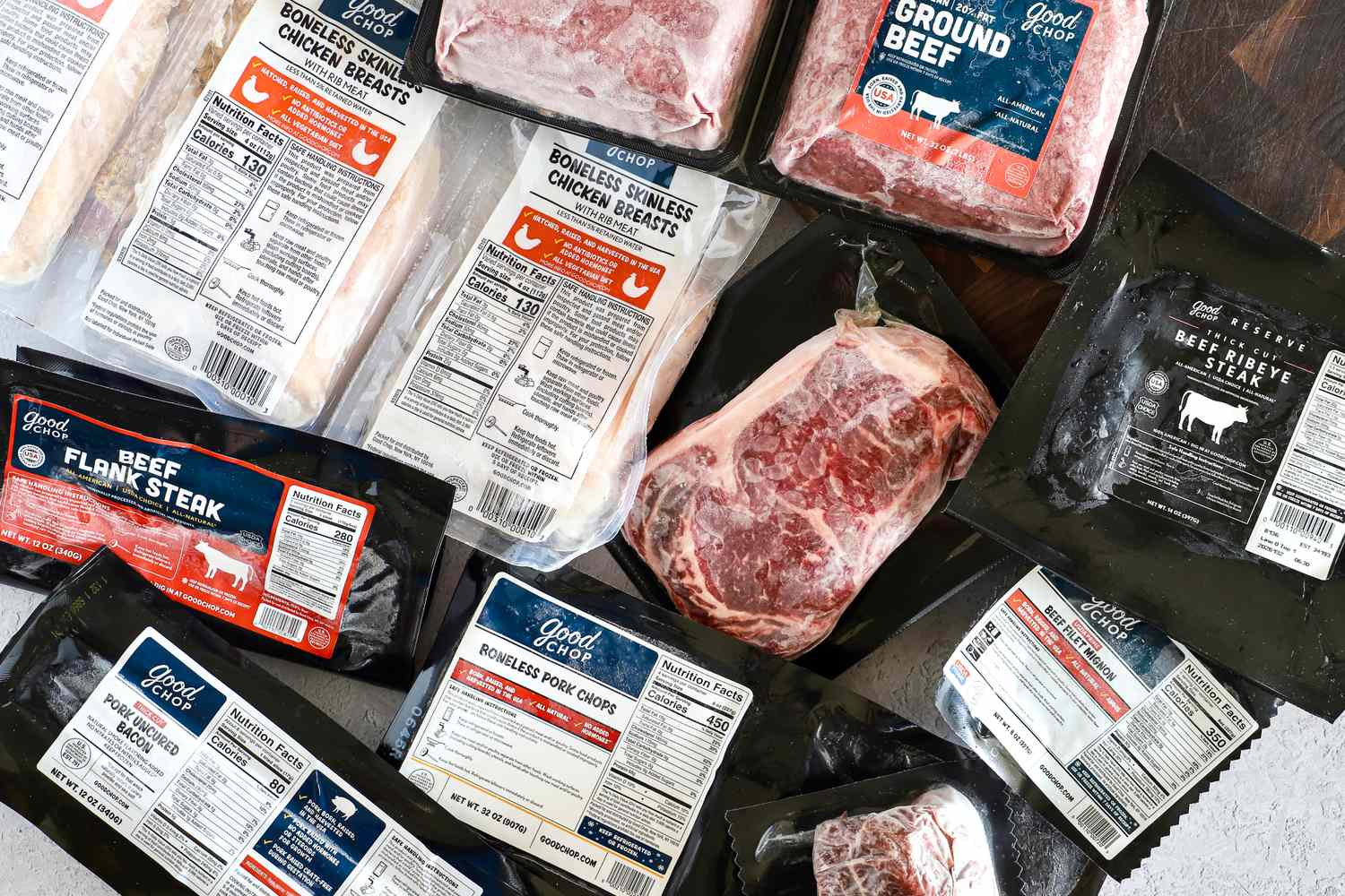 A selection of Good Chop meat products including beef pork and chicken with visible nutrition labels