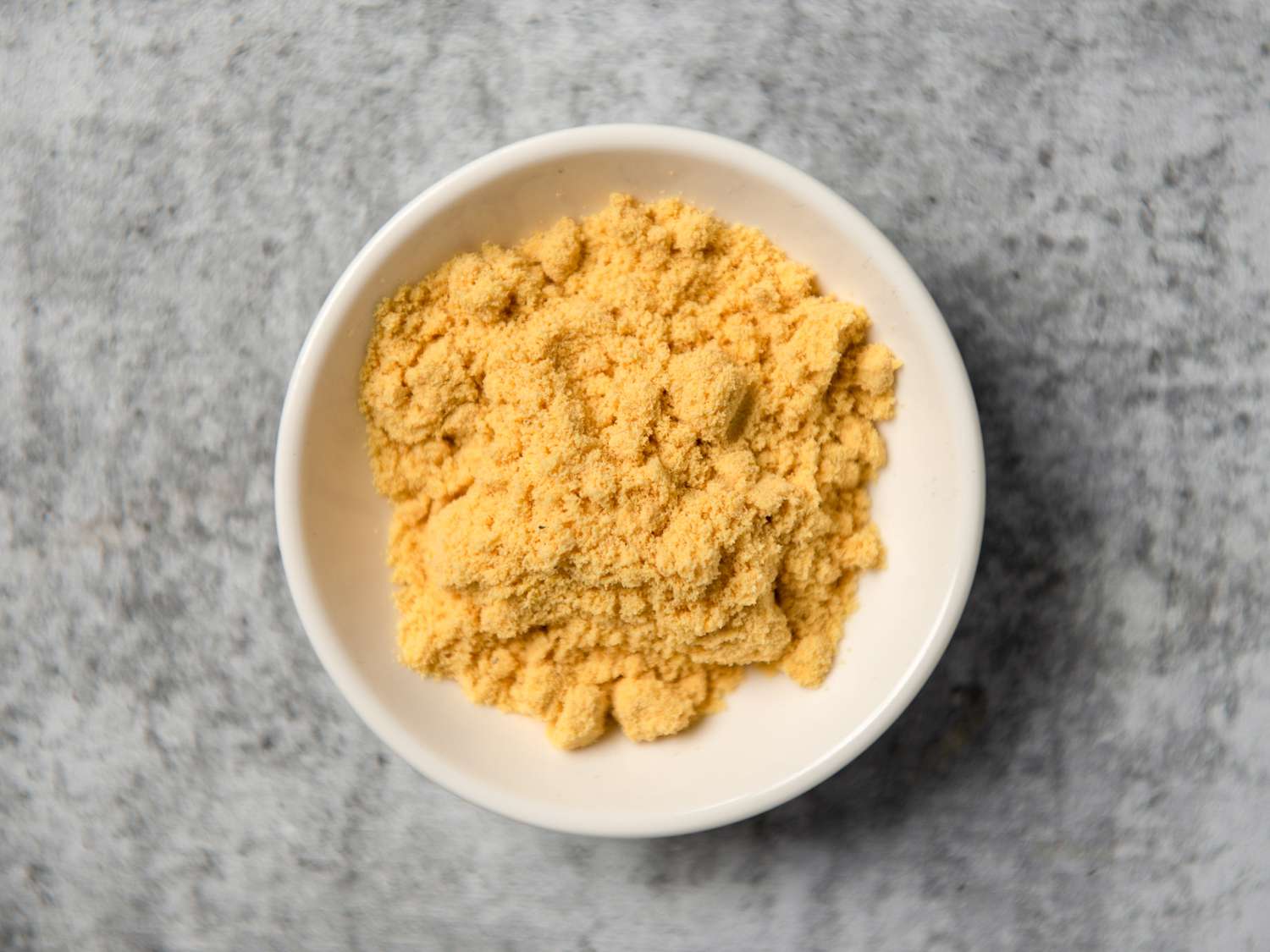 Colman's English mustard powder in a small white bowl