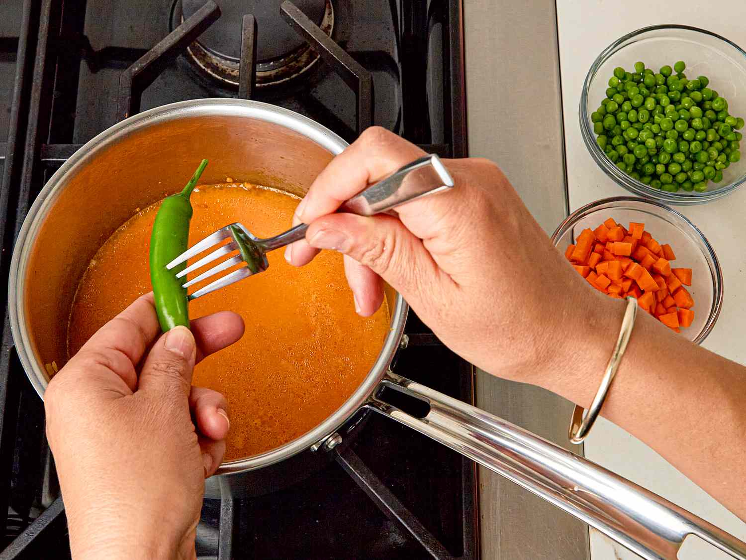 Side view of poking pepper with fork