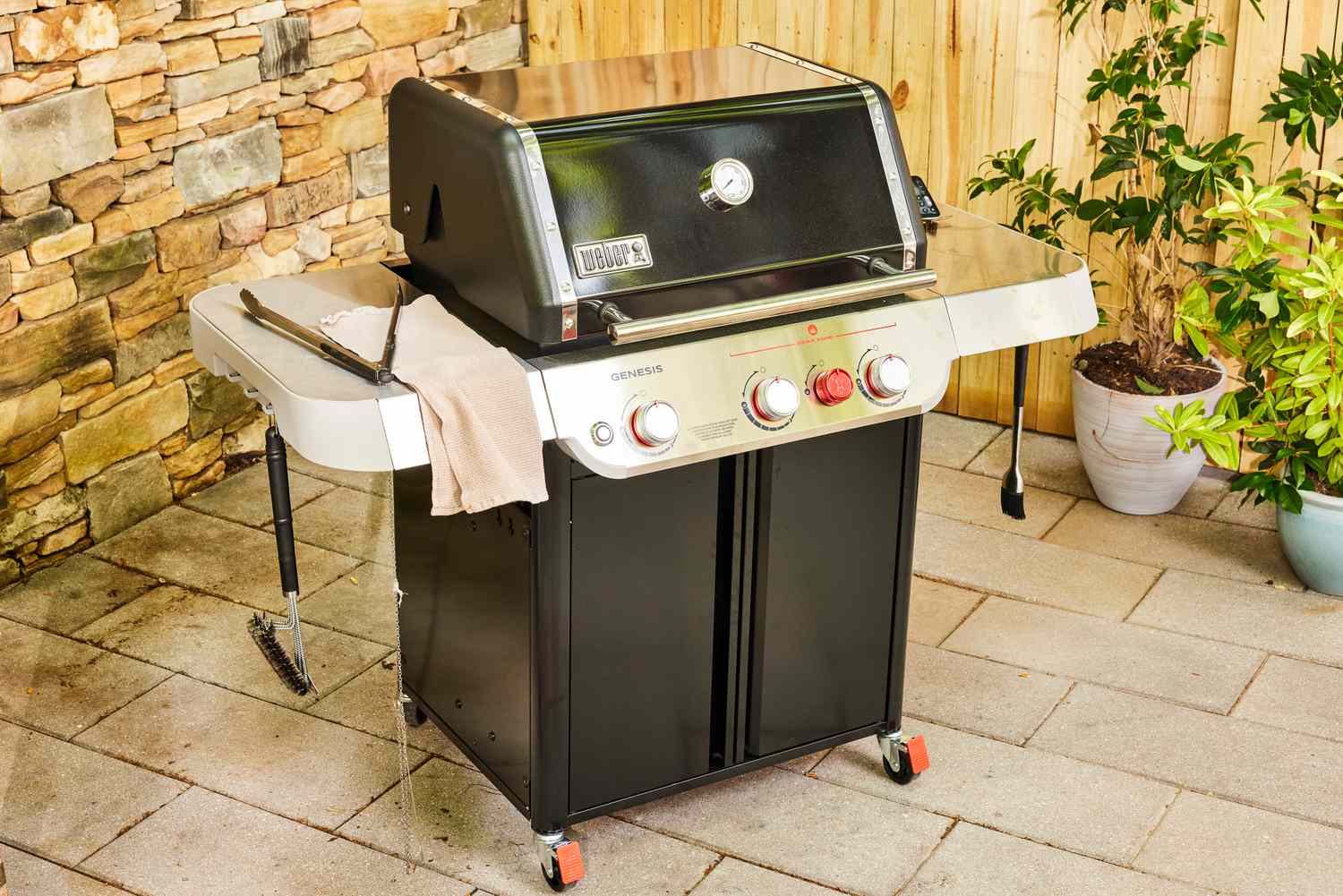 The Weber Genesis E-325 Liquid Propane Gas Grill on a patio