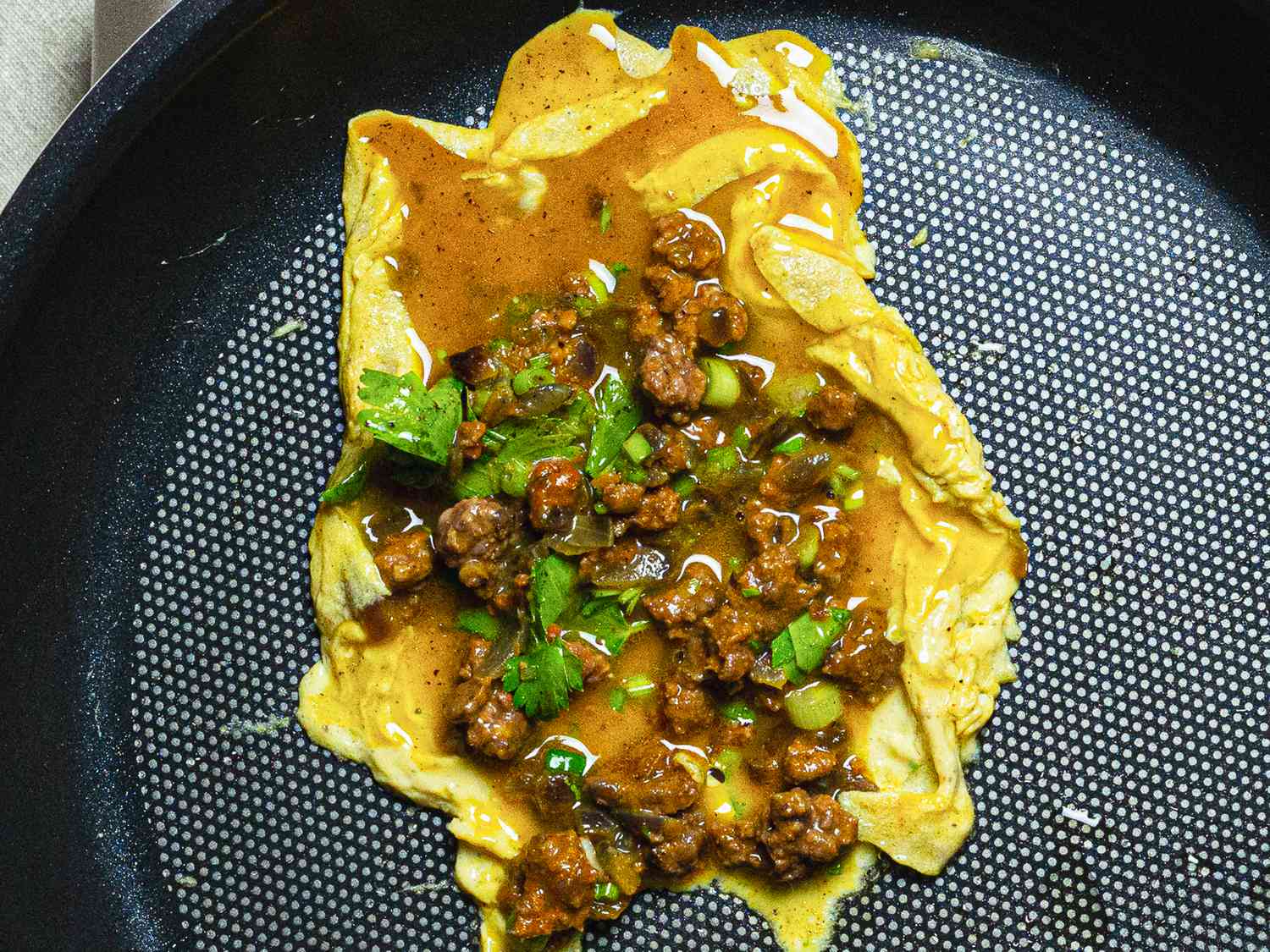 Overhead view of omelette cooking