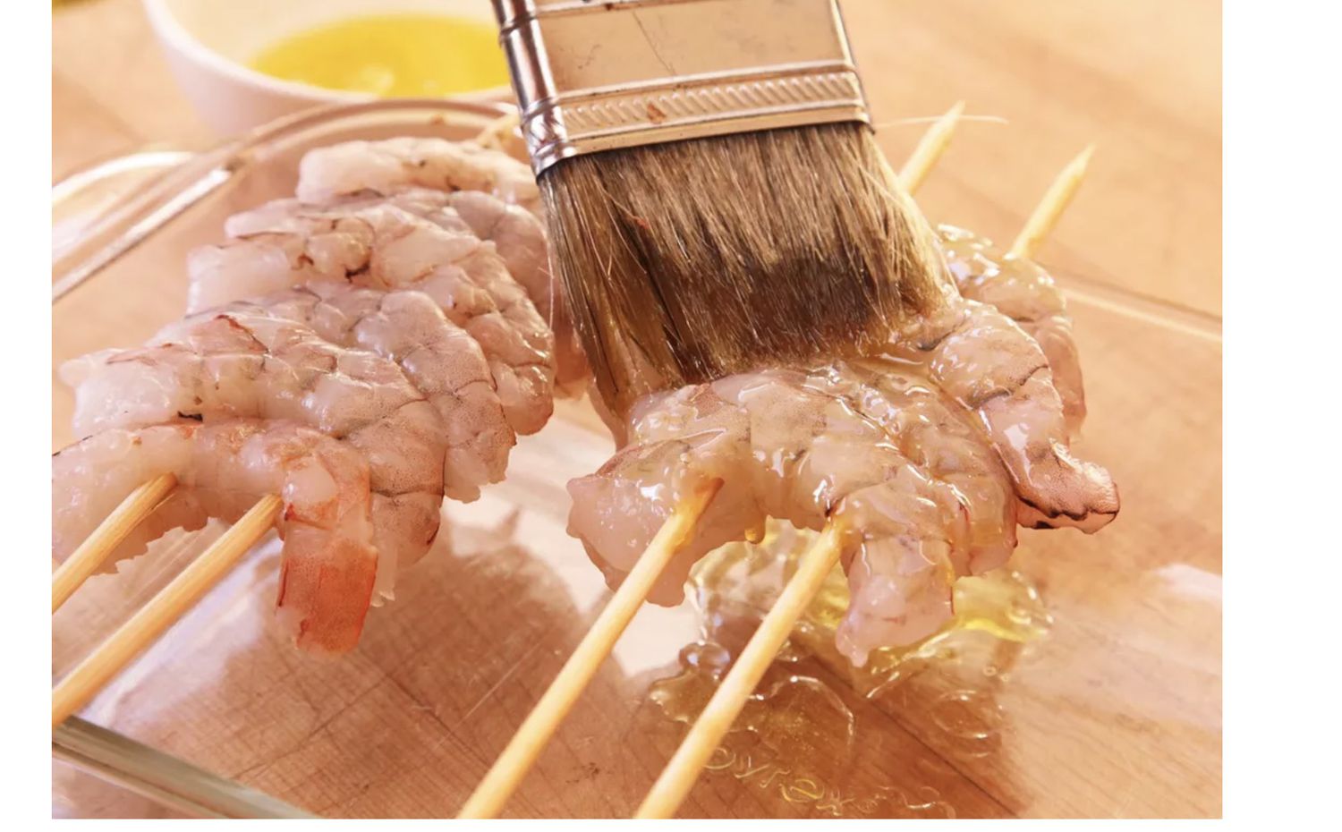 threading shrimp onto skewers