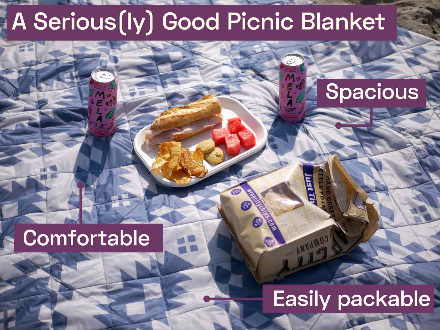 the pendleton picnic blanket with two watermelon waters, a plate of chips, watermelon and a ham sandwich, and a bag of potato chips