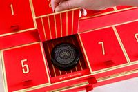 A door of the Caviar Co 12 Days of Caviar Advent calendar opened to reveal a jar of caviar