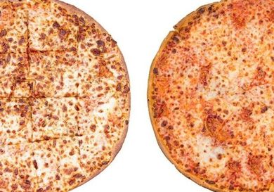 A Papa John's thin crust pizza next to a Domino's thin crust pizza. 