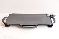 The Presto electric griddle on a white marble countertop