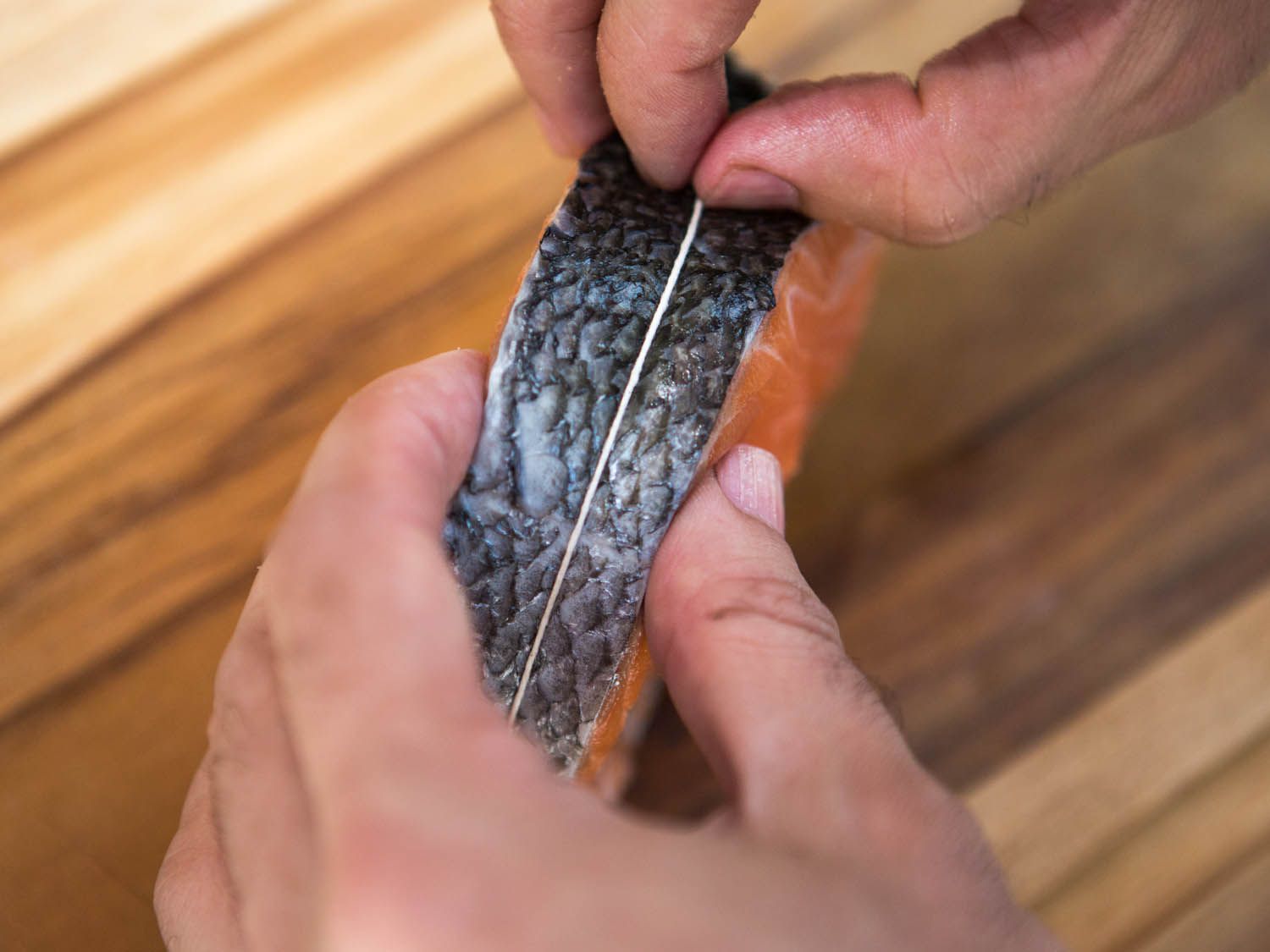 Making sure the string wrapped around the steak is centered on the salmon steak.