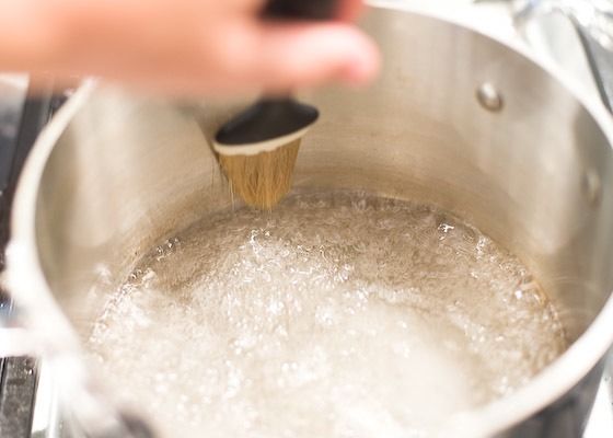 washing down the sides of the pan