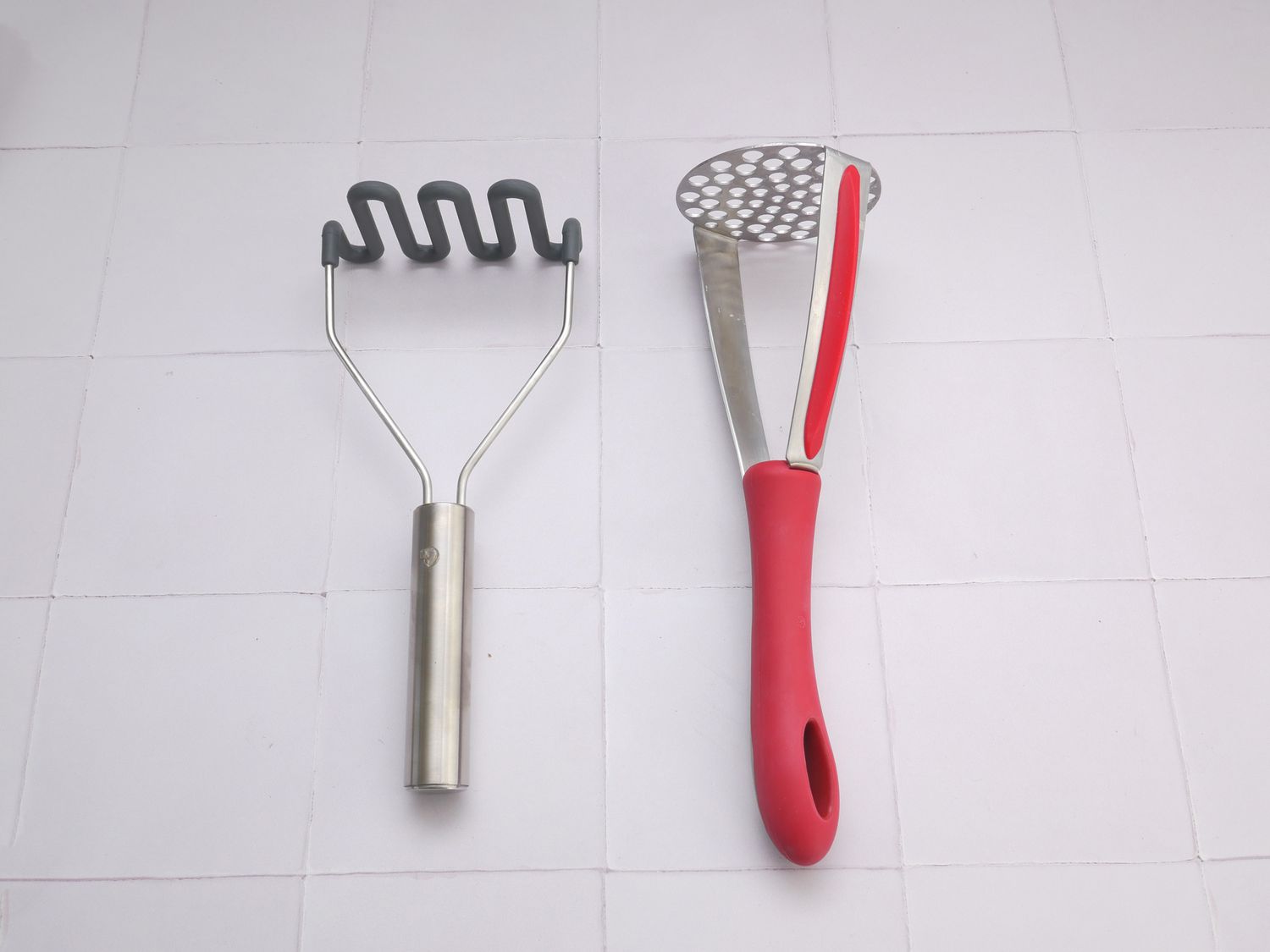 a wired potato masher next to a perforated one
