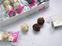 another view of two chocolate truffles and one vanilla truffle