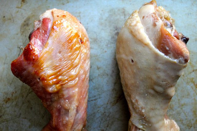 Two turkey legs, side by side. The leg on the left was roasted and the leg on the right was steamed.