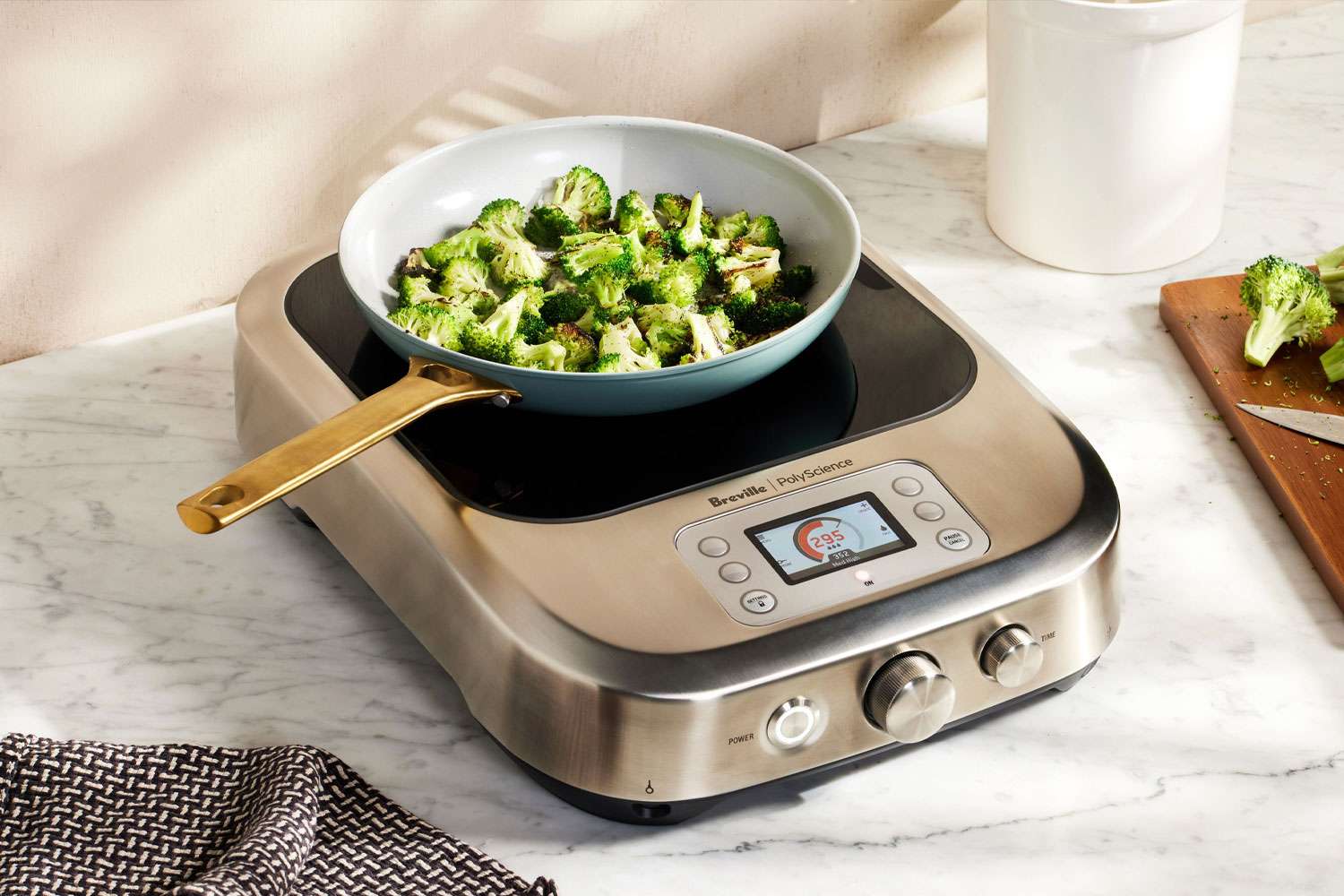 Broccoli cooking in a pan on the Breville PolyScience the Control Freak Smart Induction Cooker