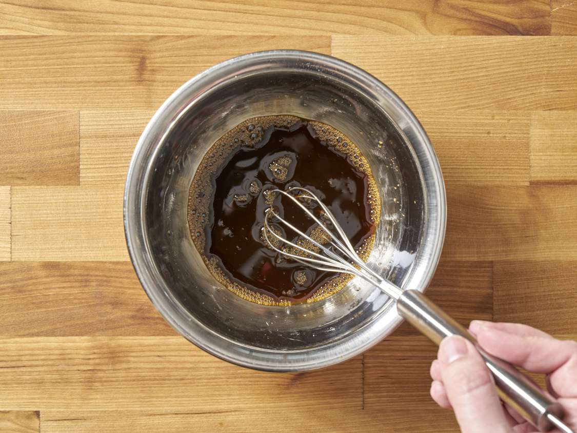 Vinegar, honey, wine, soy sauce, and cornstarch combined in a small bowl.