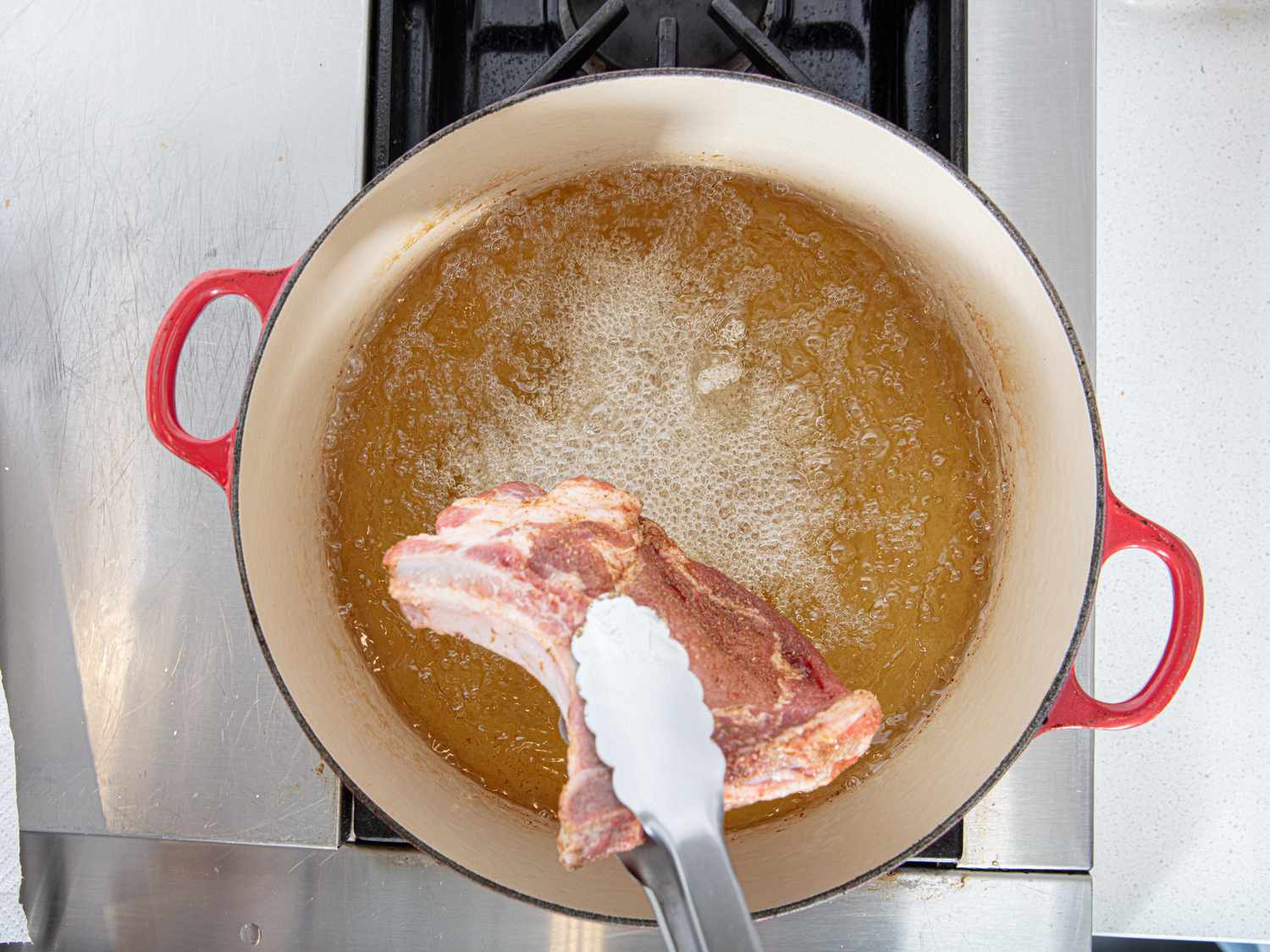 Overhead view of frying pork chop