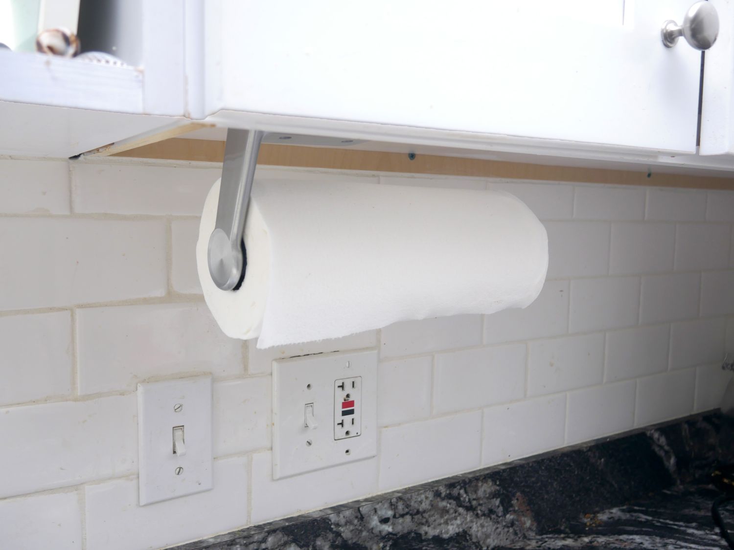 oxo paper towel holder mounted under a cabinet