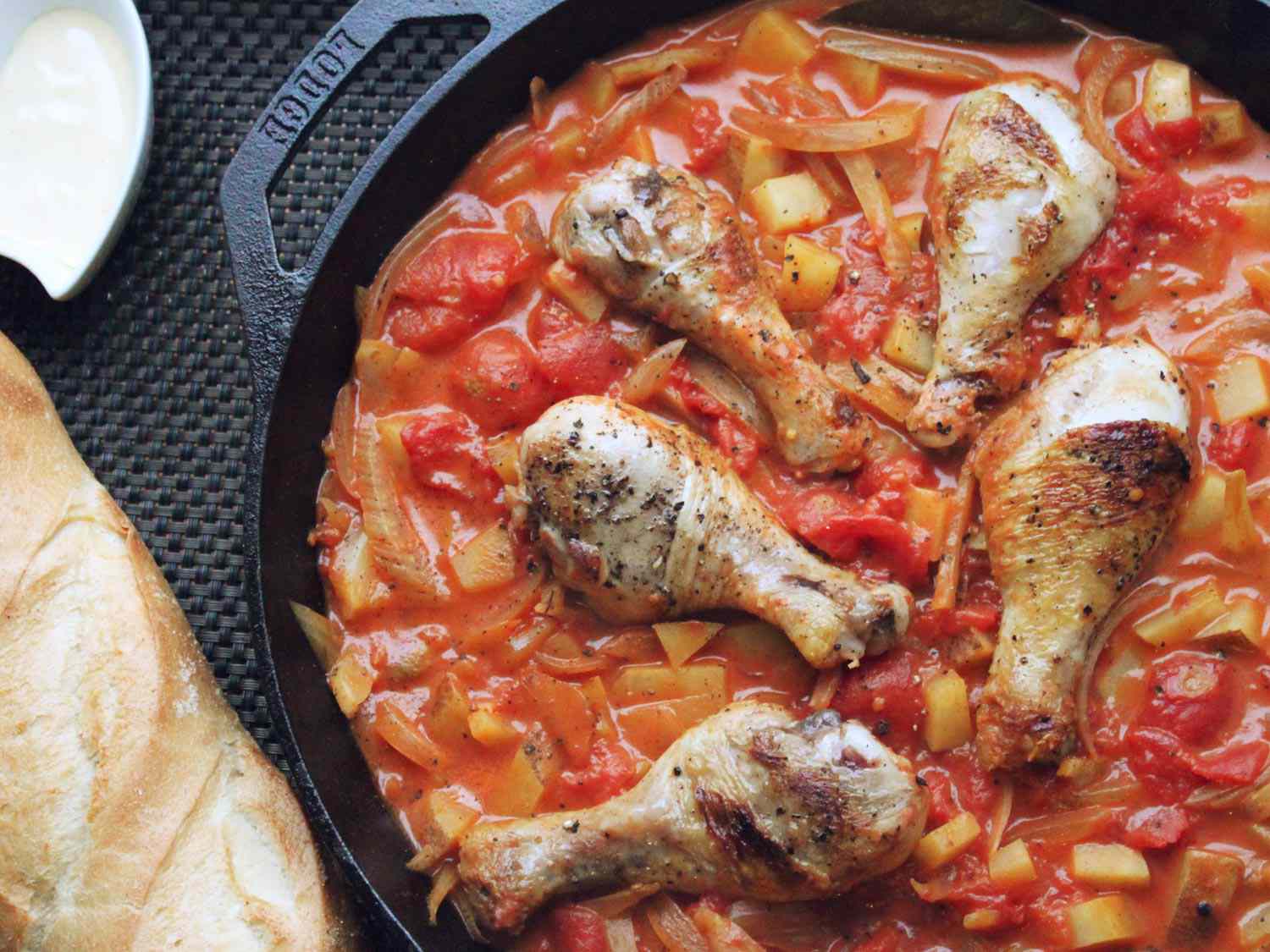 Chicken bouillabaisse served in a cast iron skillet