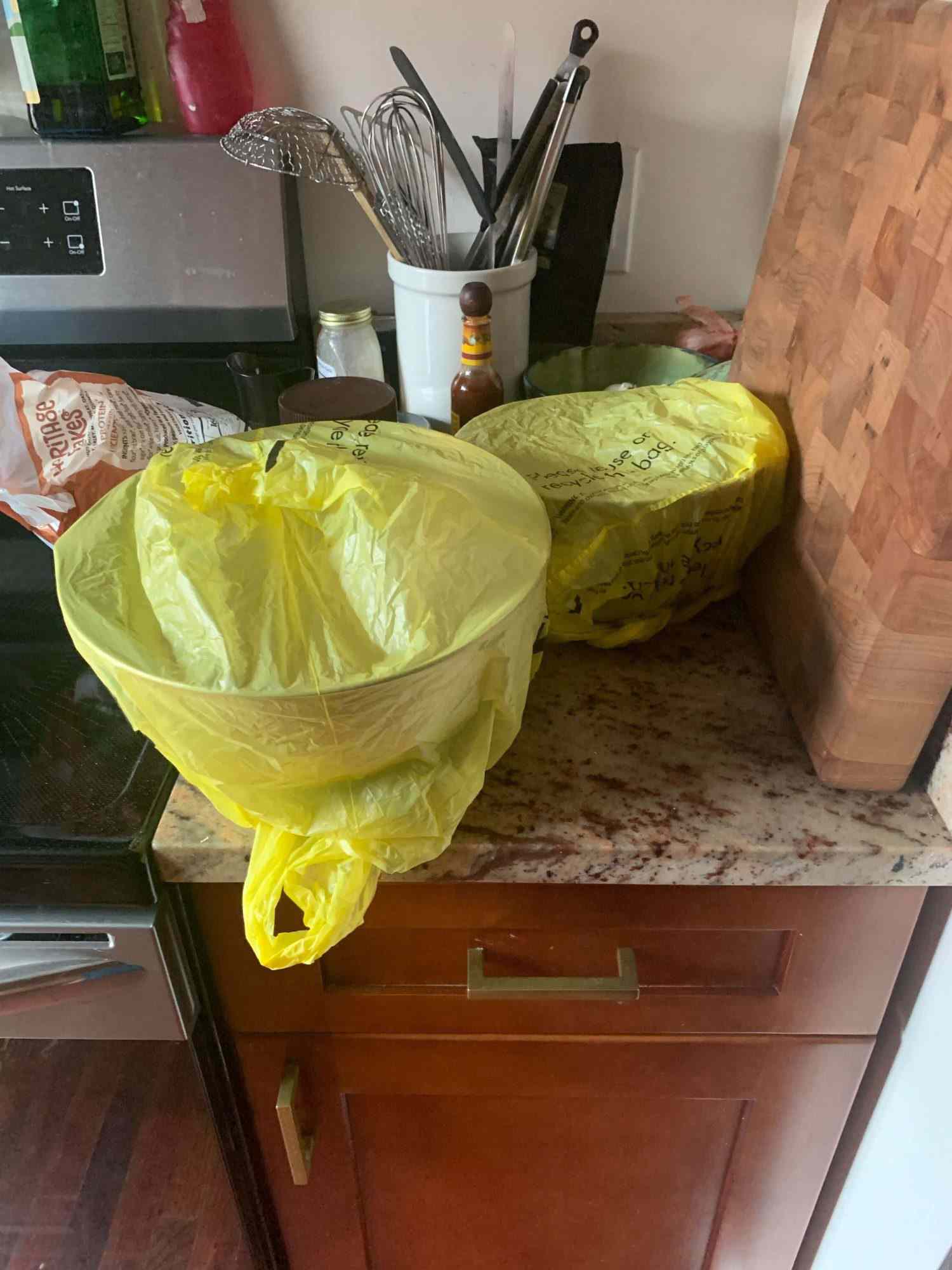 Bowls wrapped in plastic grocery bags